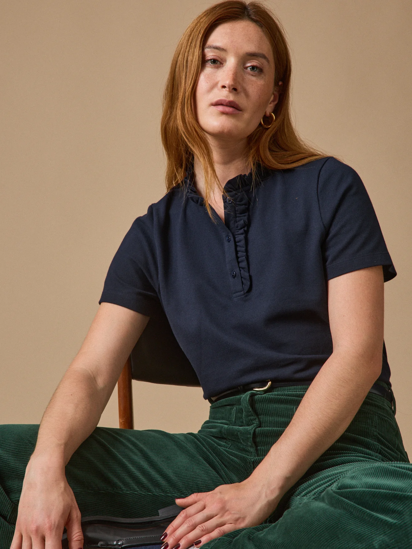 Polo maille piquée col volanté femme